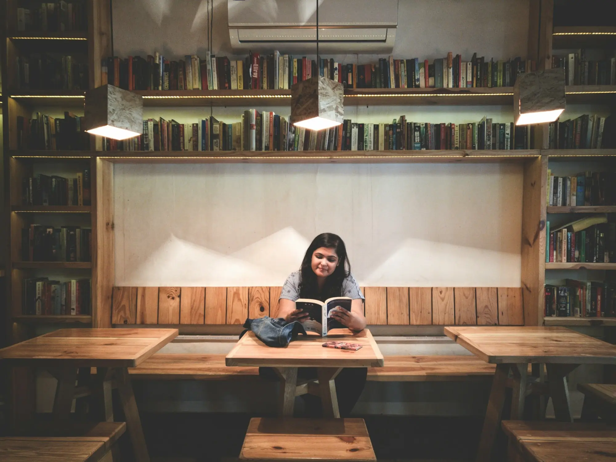 A student reading in a quiet library
